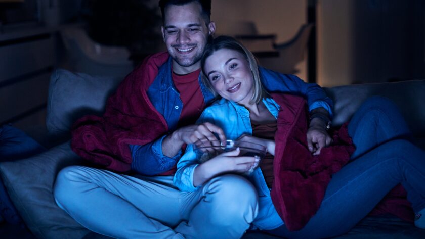 couple movie night tc laptop popcorn love watching entertainment