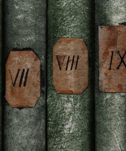 Old books with Roman numerals in the library