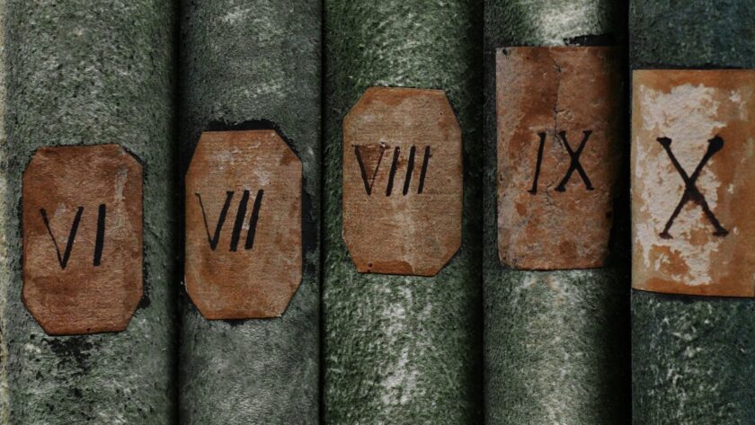 Old books with Roman numerals in the library