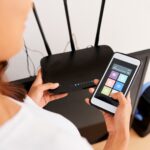 Woman Connecting to Wi-fi Router